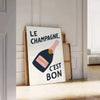 Póster de cocina 'Le Champagne C'est Bon' en tonos elegantes de verde y negro, disponible en tamaños 50x70 y 30x40, enmarcado