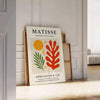 Póster Matisse Papiers Découpés com cores vibrantes em verde e laranja, ideal para amantes da arte. Disponível em vários tama