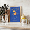 space captivating Aperol cocktail art poster vibrant blue yellow hues wall print ideal gift lovers splash creativity room available